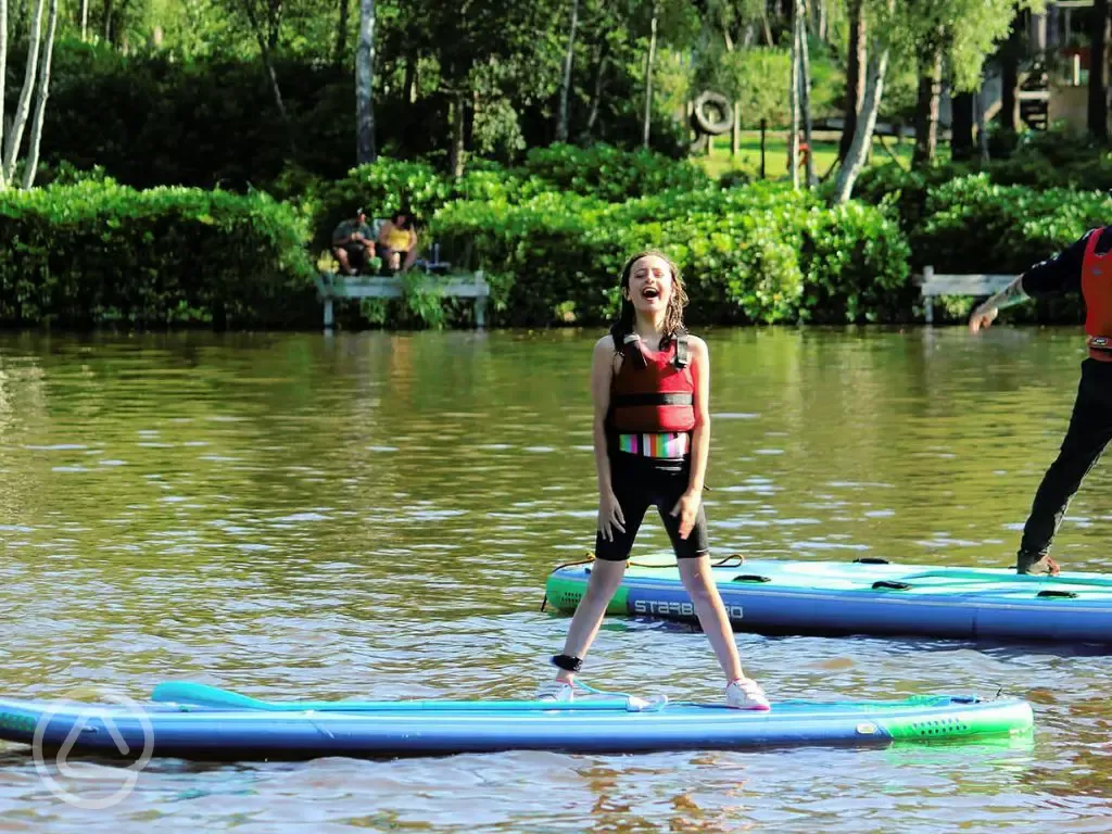 Paddle boarding on Avon Tyrrell Lake