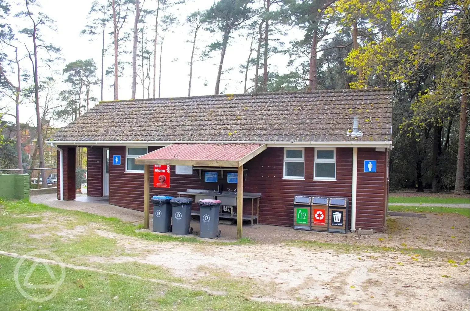 Facilities block with a sheltered washing up area and recycling points