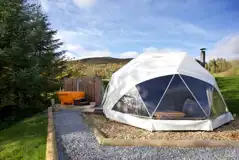 Camping dome with hot tub