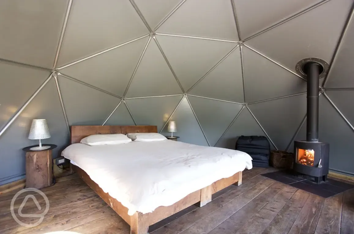 Double bed and wood burning stove of camping dome 