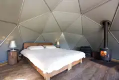 Double bed and wood burning stove of camping dome 