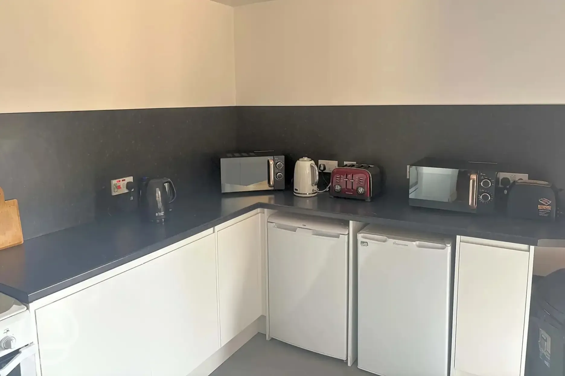 Communal kitchen with communal fridges, kettles, toasters, and microwaves