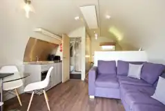Kitchen and sofa in the superior ensuite glamping pod