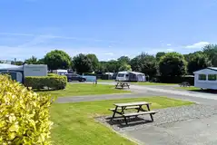 Fully serviced hardstanding pitches with private picnic benches Fully serviced hardstanding pitches with private picnic benches