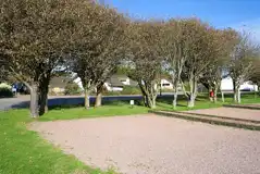 Electric gravel touring pitches with wooden dividers Electric gravel touring pitches with wooden dividers