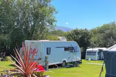 Electric grass pitches with 16 amp electric and mountain views at Rhyd y Galen