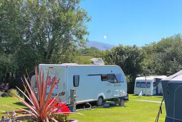 Electric grass pitches with 16 amp electric and mountain views at Rhyd y Galen