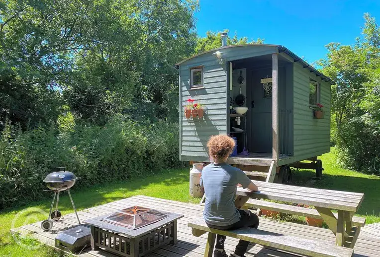 Shepherd's hut sleeping two with a private fire pit and decking at Rhyd y Galen