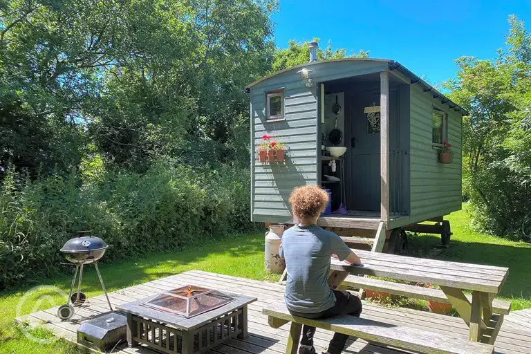 Shepherd's hut sleeping two with a private fire pit and decking at Rhyd y Galen