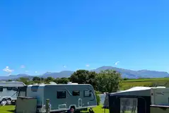 Electric grass pitches with mountain views