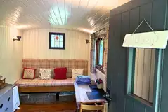 Shepherd's Hut living area with dining space