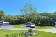 Fully serviced hardstanding pitches with grass in between