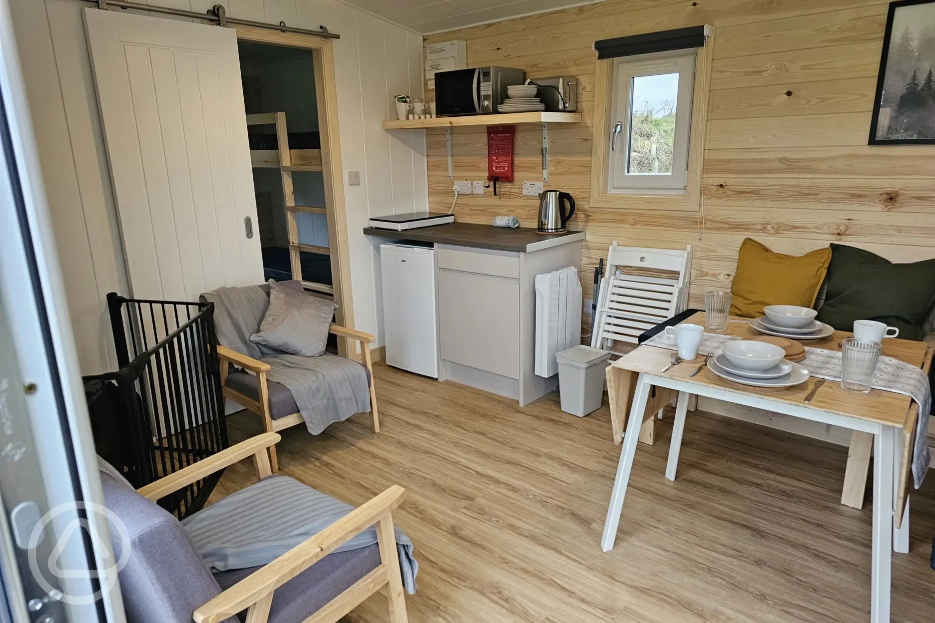 Bothy pod equipped kitchenette and seating area Bothy pod equipped kitchenette and seating area