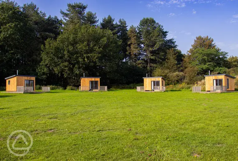 Bothy pods exterior with a private veranda at Sherwood Pines Campsite