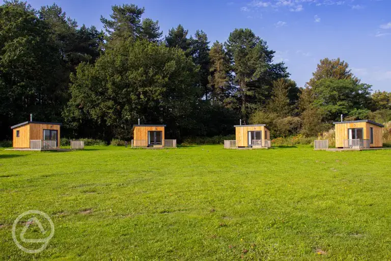 Bothy pods exterior with a private veranda at Sherwood Pines Campsite