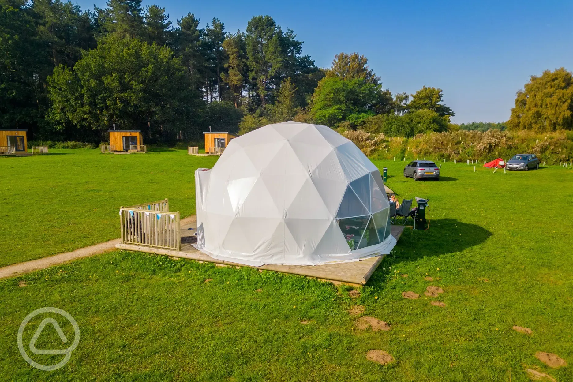 Geodome exterior with camper chairs and decking at Sherwood Pines Campsite Geodome exterior with camper chairs and decking at Sherwood Pines Campsite