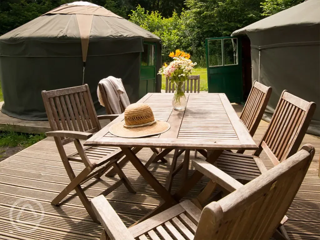 Woodland yurt outdoor dining area