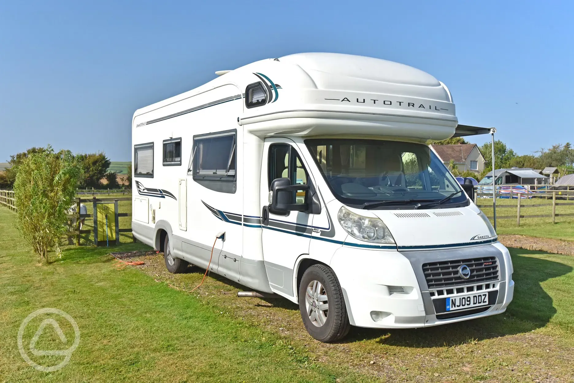 Fully serviced hardstanding pitch with driveway