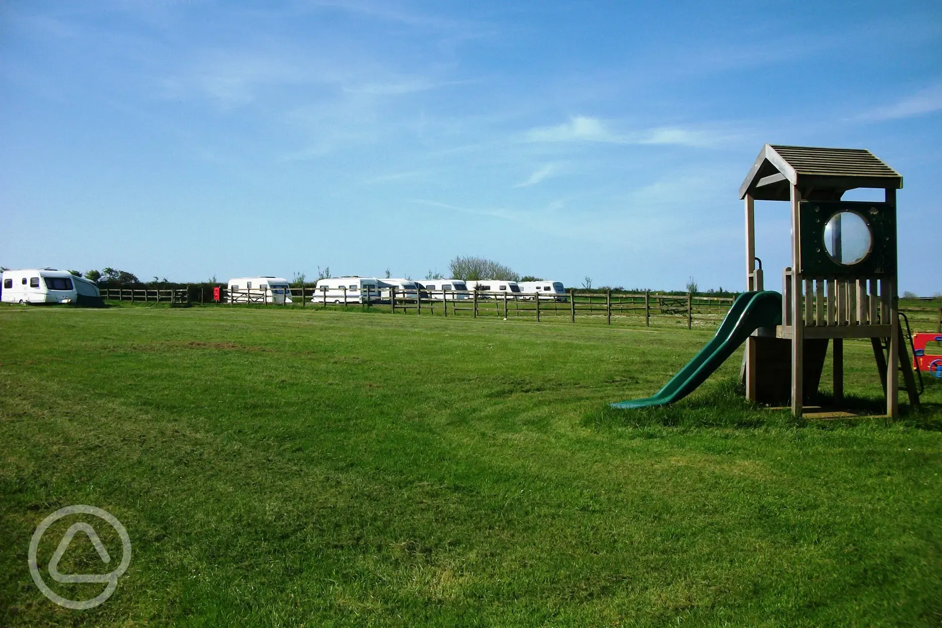 Play area and caravans at Sunnymead Farm