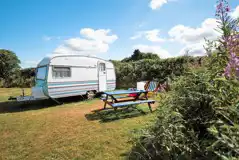 Dolly vintage caravan with outdoor furniture and deck chairs