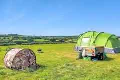 Non electric wild grass tent pitches, set away from the main campsite