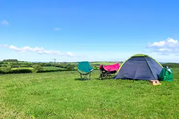 Non electric wild grass tent pitches, set away from the main campsite