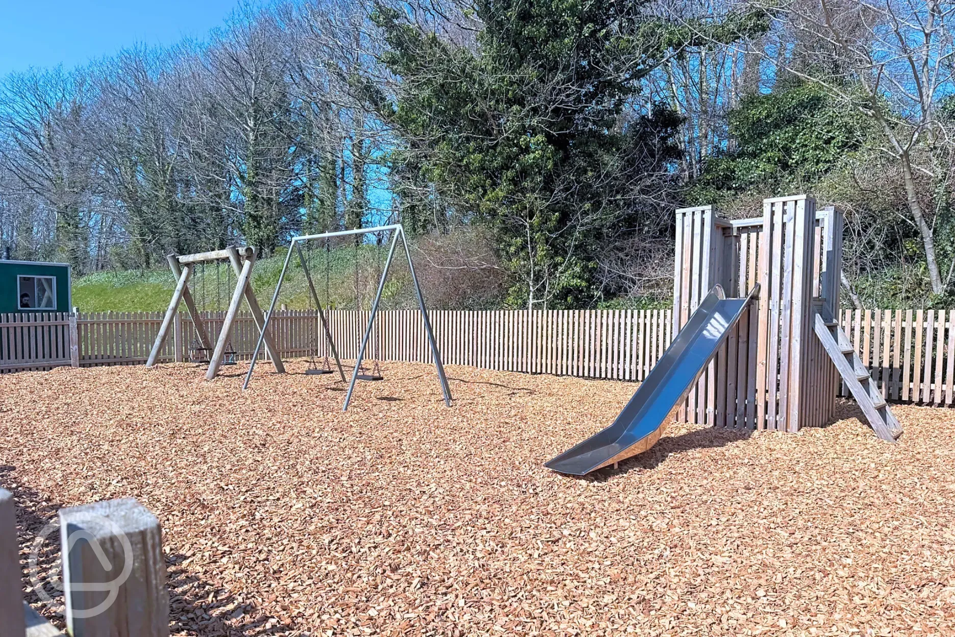 Play park with a slide, two baby swings and two flat seat child swings