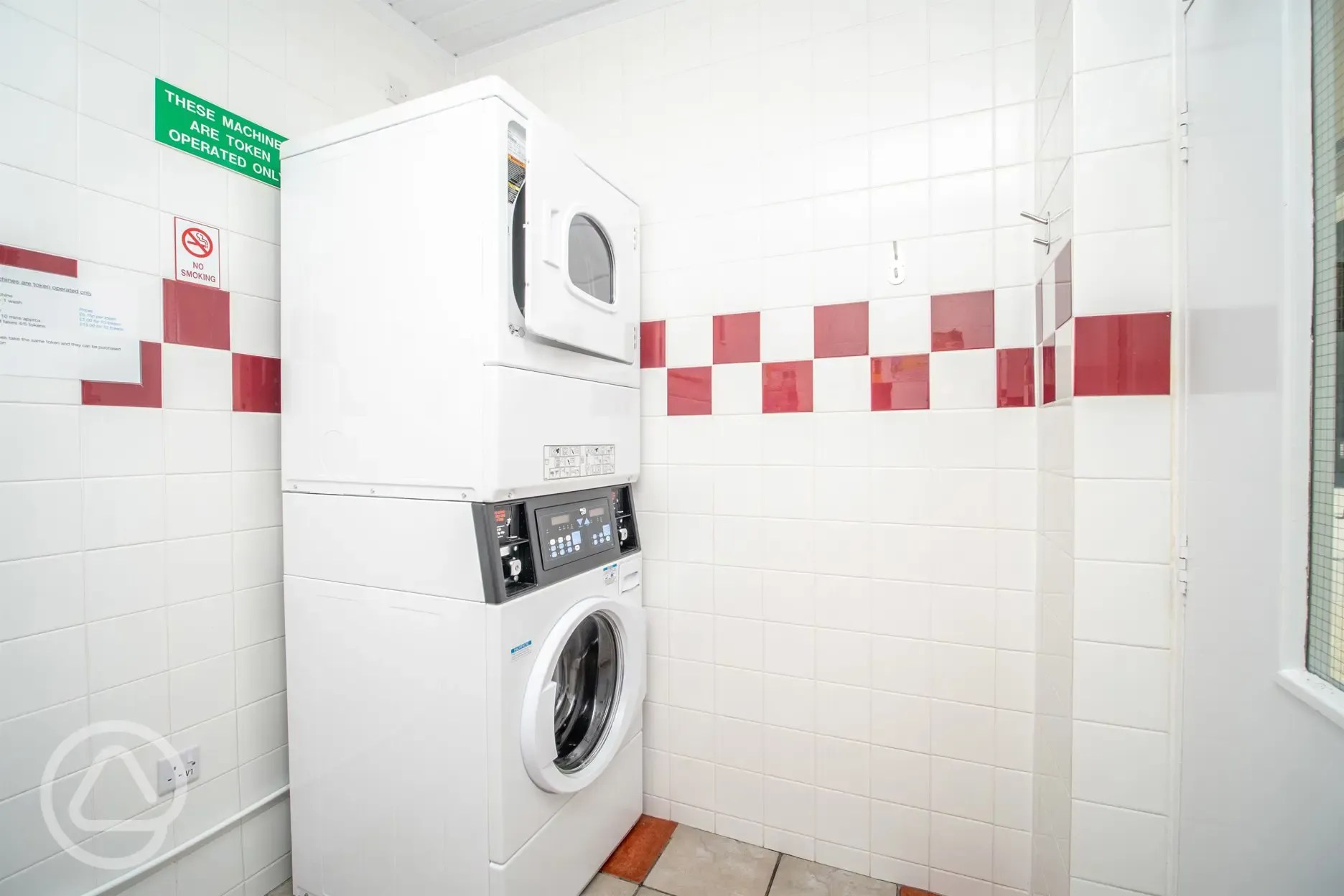 Laundry area with a washing machine and tumble dryer