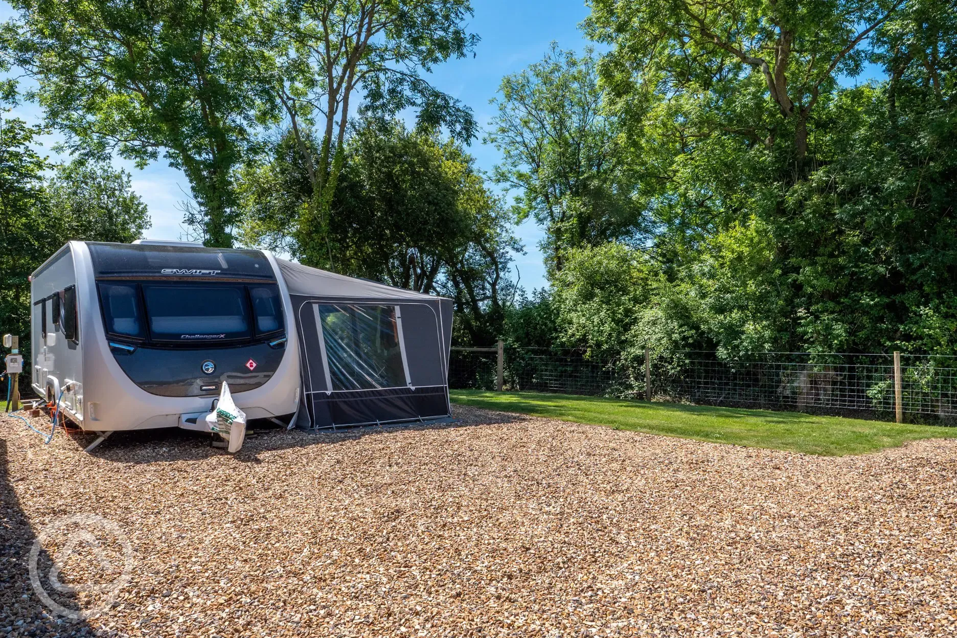 Fully serviced hardstanding pitches with primary gravel