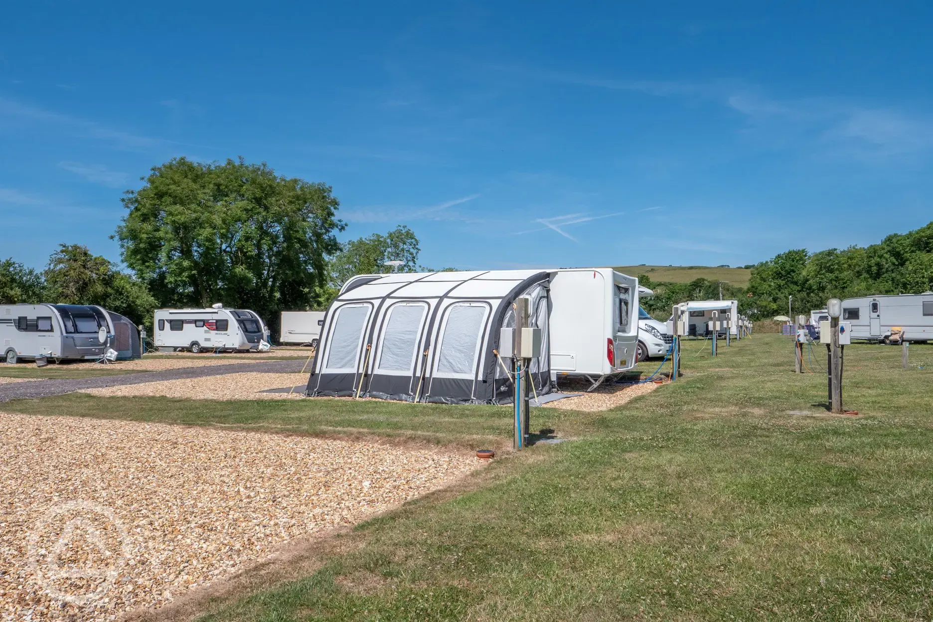 Fully serviced hardstanding pitches with primary gravel