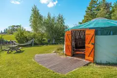 Far Field yurt with a picnic bench and hammock