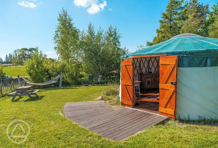 Far Field yurt with a picnic bench and hammock