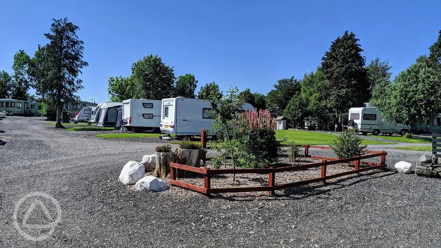 Caravans on electric hardstanding pitches with awnings