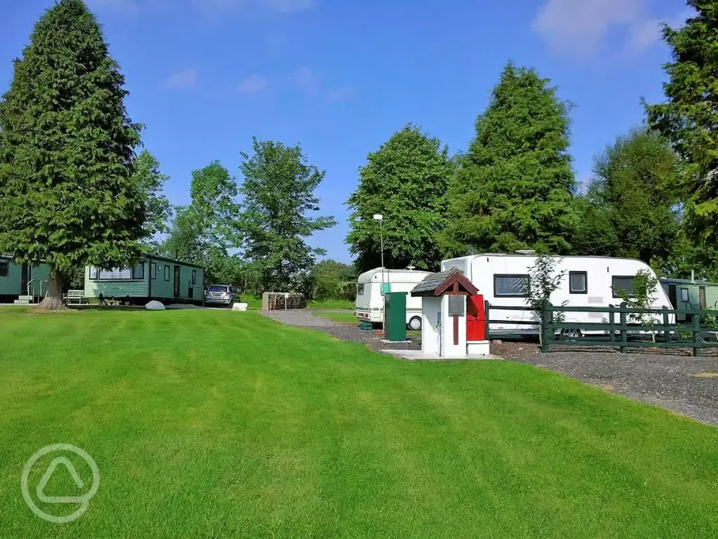 Electric hardstanding pitches next to static caravans