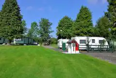Electric hardstanding pitches next to static caravans Electric hardstanding pitches next to static caravans