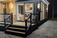 Blencathra camping pod at night with outdoor lighting