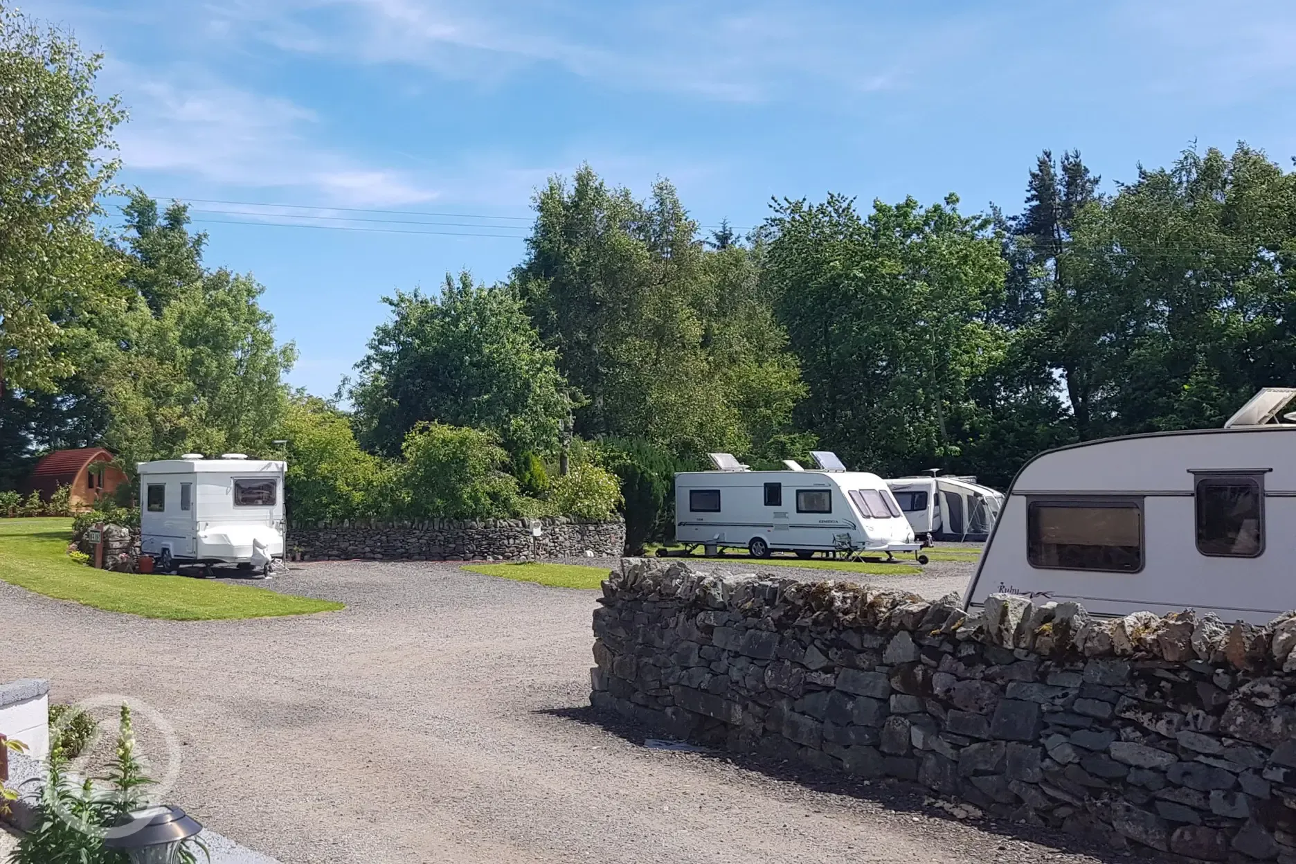 Caravans on electric hardstanding pitches with awnings