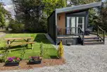 Blencathra camping pod with parking space, picnic bench, and decking