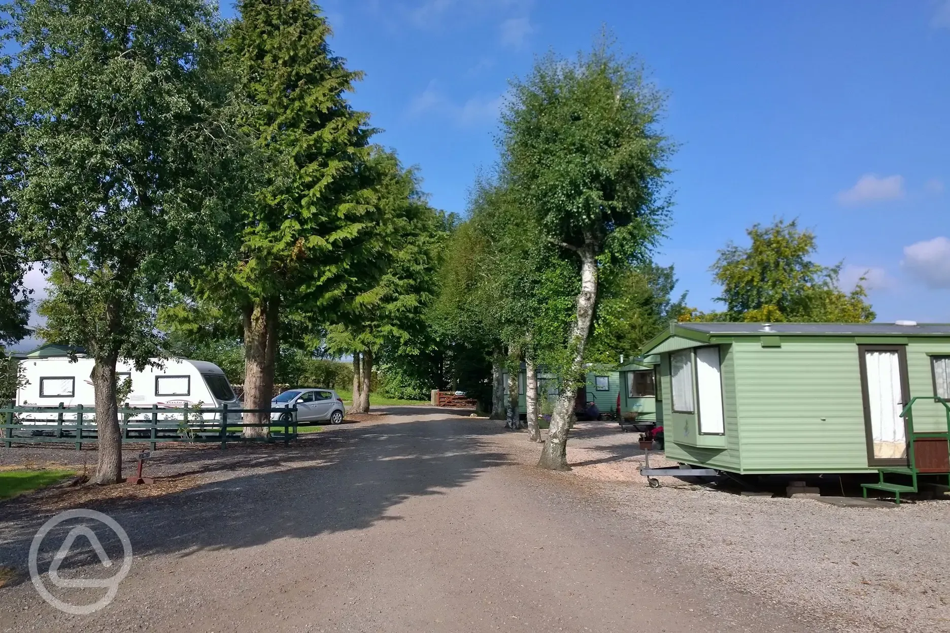 Electric hardstanding pitches next to static caravans