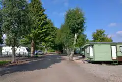 Electric hardstanding pitches next to static caravans Electric hardstanding pitches next to static caravans