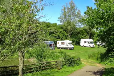 Grass pitches at Old Barn Touring Park for tourers