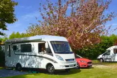 Electric grass pitches at Old Barn Touring Park