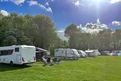 Electric grass touring pitches measuring 8m by 5m