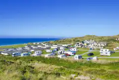 Aerial of fully serviced grass pitches and sea views at Beachside Holiday Park