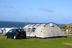 Large electric grass pitch with 16 amp hook up (11m x 14m)