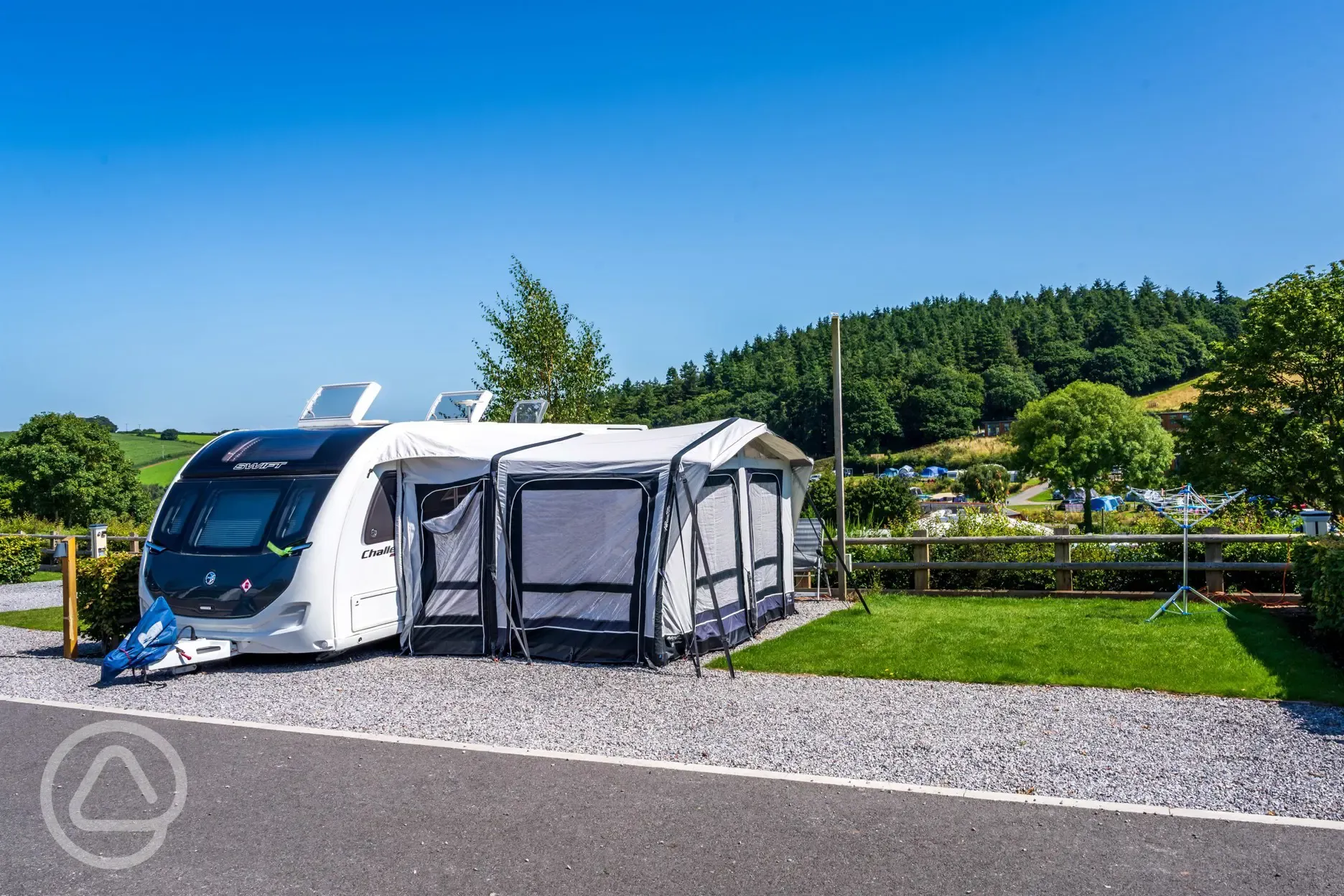 Caravan and awning an a short stay electric hardstanding pitch (8m)