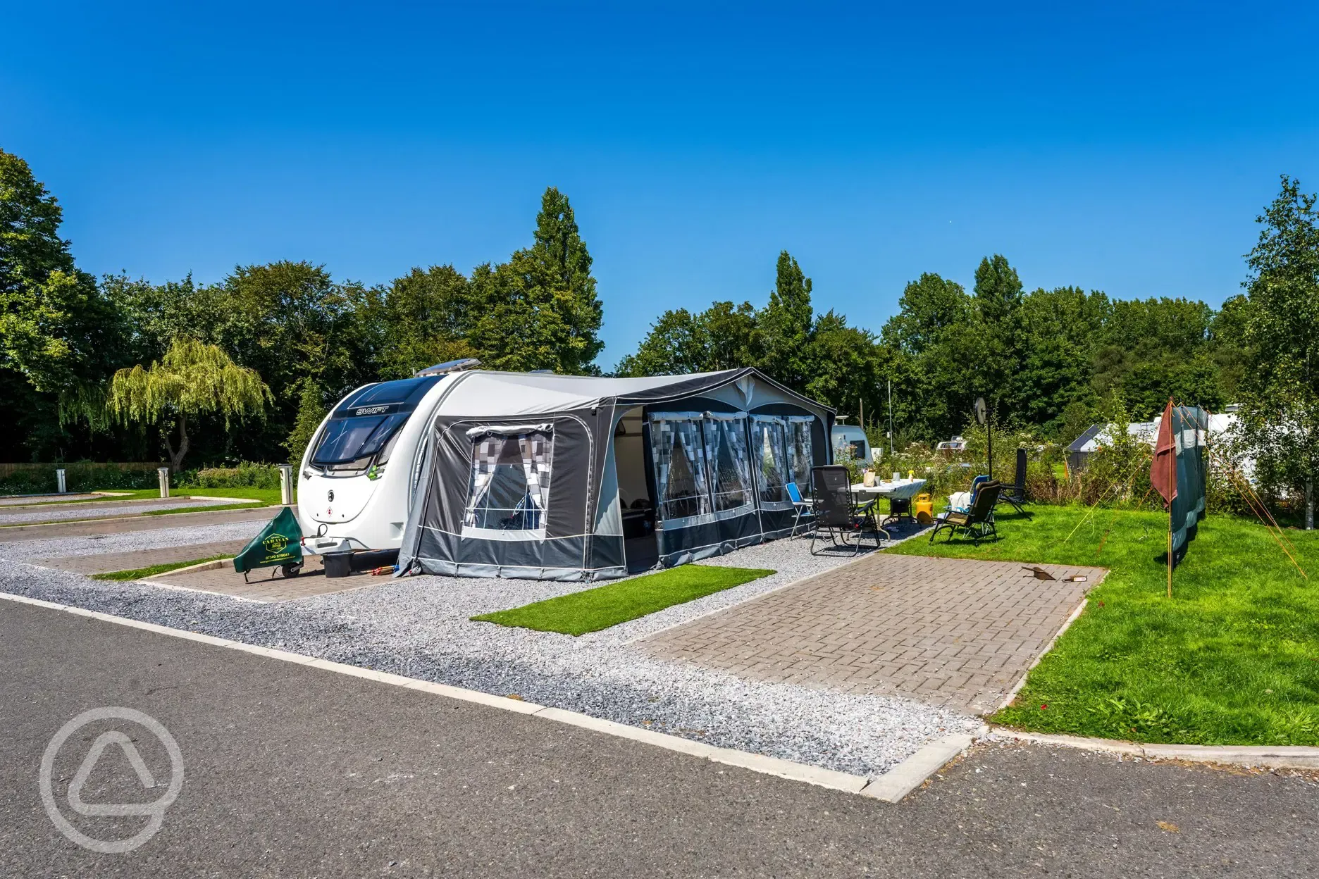 Caravan and awning on super electric hardstanding pitch (8m)