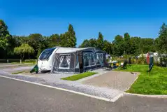 Caravan and awning on super electric hardstanding pitch (8m)
