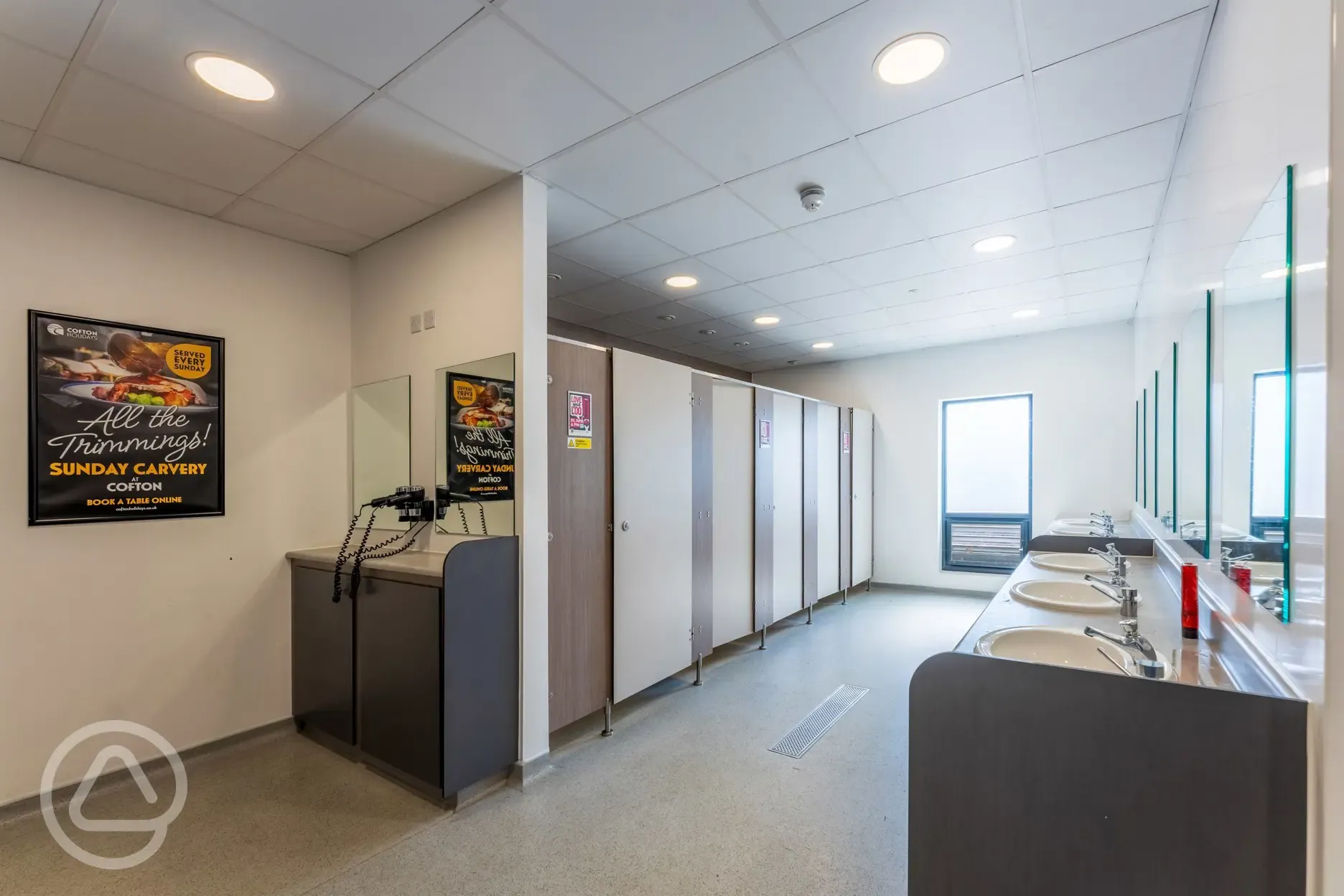 Toilet block with sinks and hairdryers