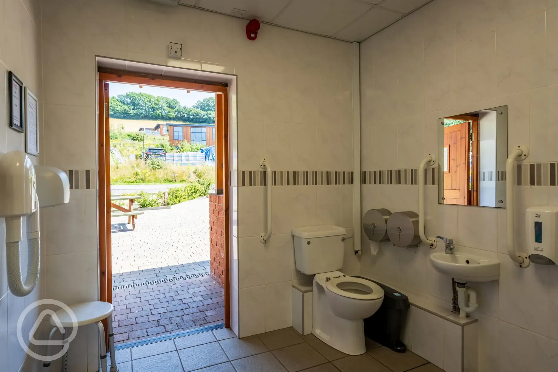 Disabled bathroom with hand rails for support